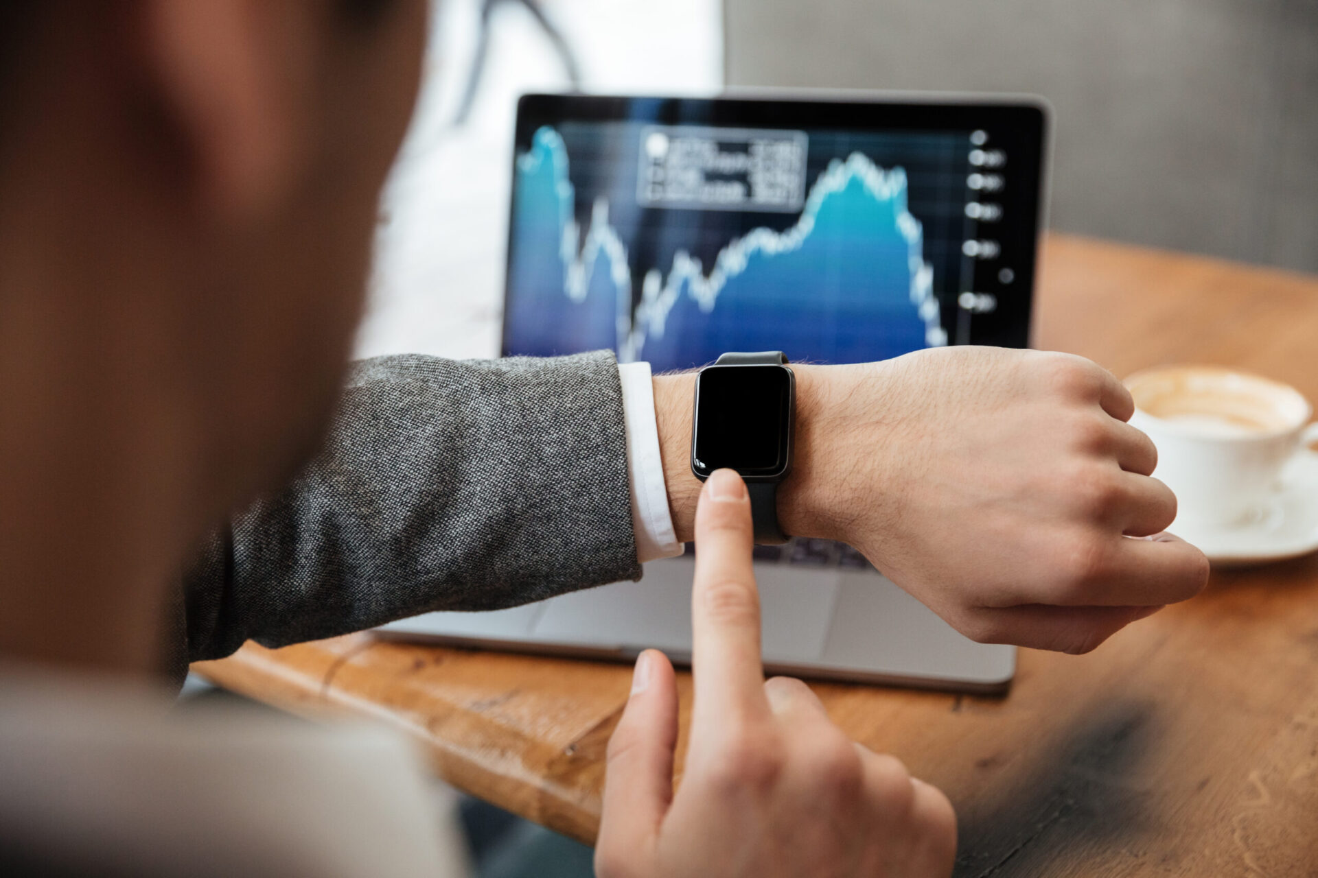 Cropped Image Businessman Sitting By Table Cafe Analyzing Indicators Laptop Computer While Using Wristwatch Scaled
